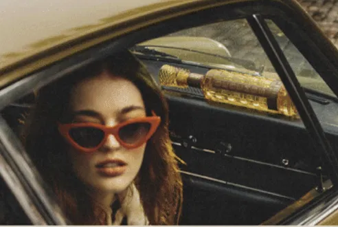 Woman in vintage car with Bebemos on dashboard